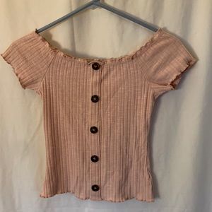 NoBo Juniors on/off-shoulder knit top. Light pink with deco buttons. Slim fit.